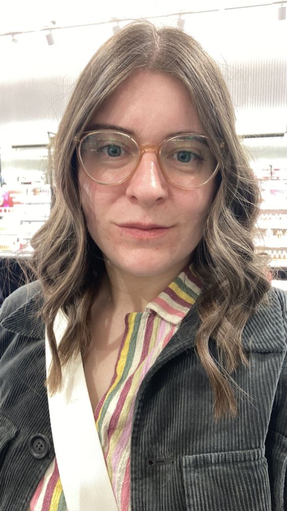 Me with salon curled swishy hair, cut to around shoulder length