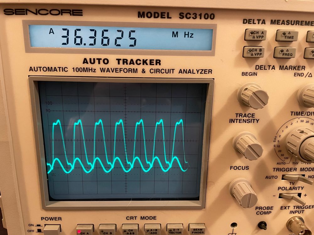 An analog oscilloscope showing a 36MHz signal.