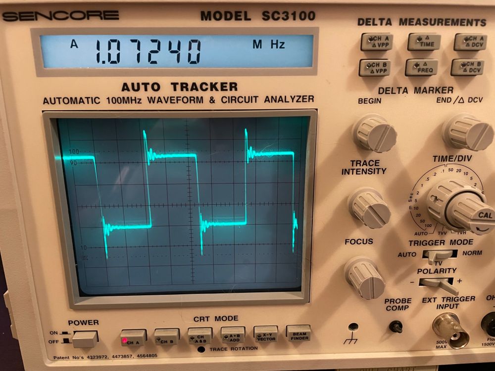 An analog oscilloscope showing a 1MHz square wave