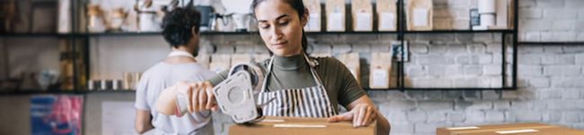 Image from USPS of a female preparing an ecommerce shipment