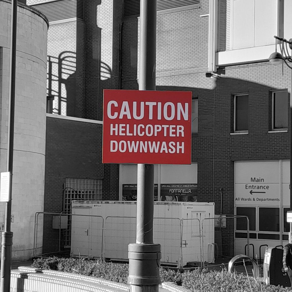Caution Helicopter Downwash 

warning sign at Leeds General Infirmary