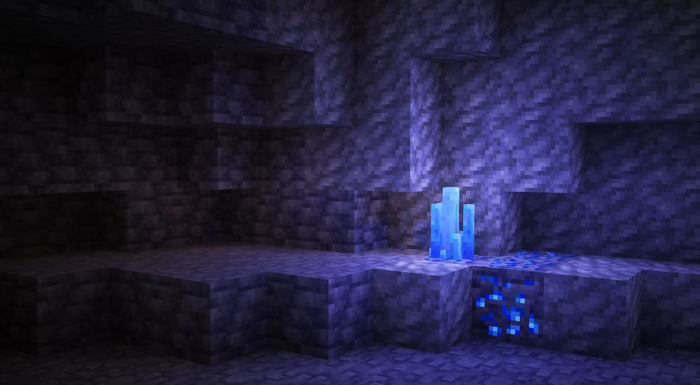 Minecraft: a lapislazuli formation in a tuff and deepslate cave corner