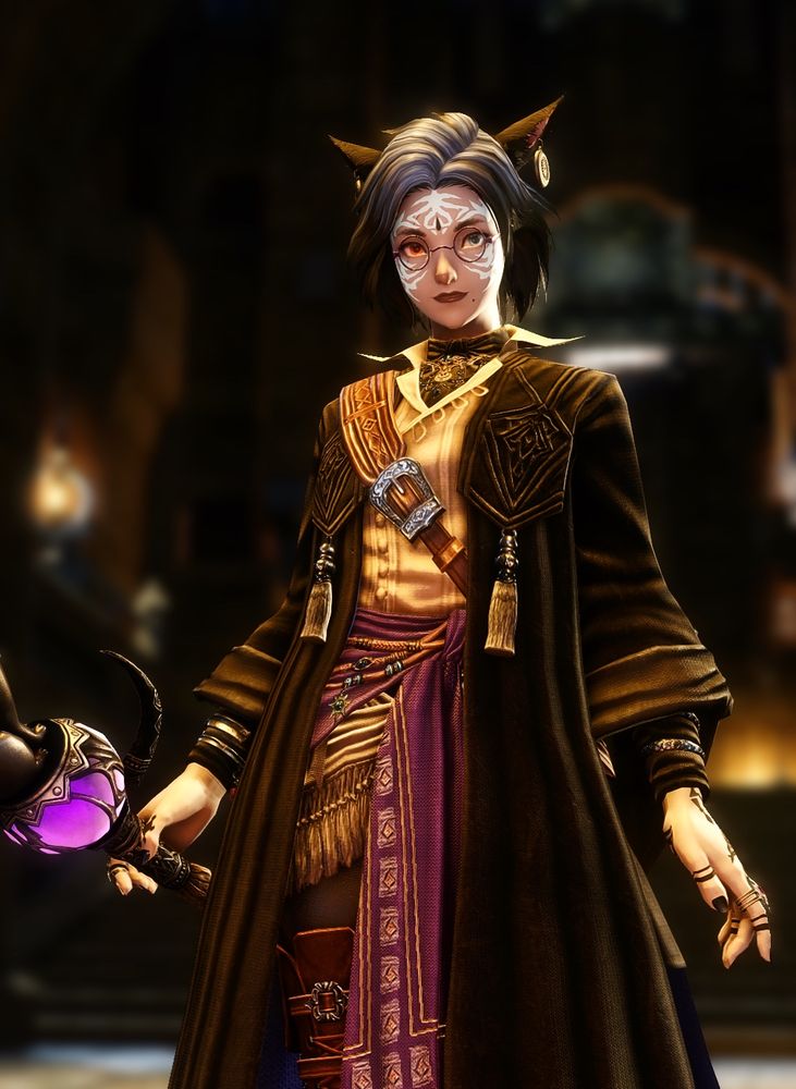 Gently smiling female moon Miqote black mage with shoulder length black hair and blue highlighted hair wearing round glasses and black tr