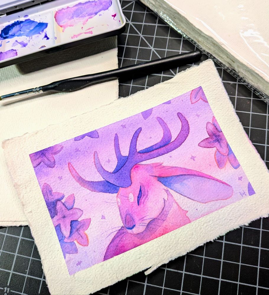 Photo of a purple and pink jackalope painting.