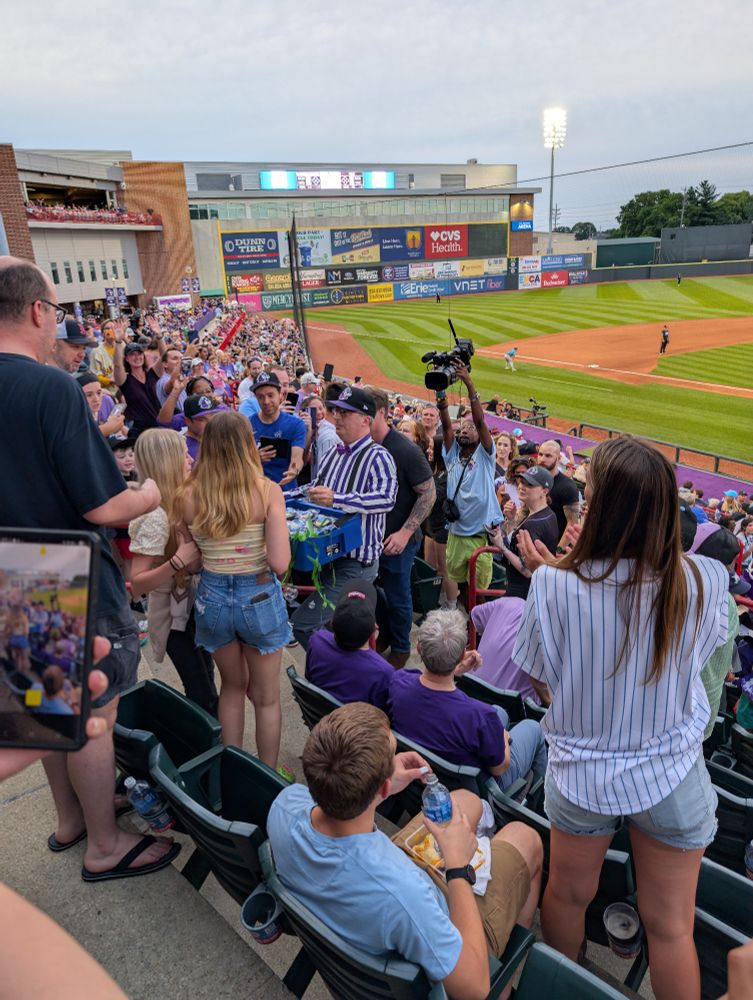 John Oliver dressed as a baseball umpire throwing Moon Pies at innocent civilians at the inaugural Erie Moon Mammoths minor league baseball game against the Chesapeake Oyster Catchers. 