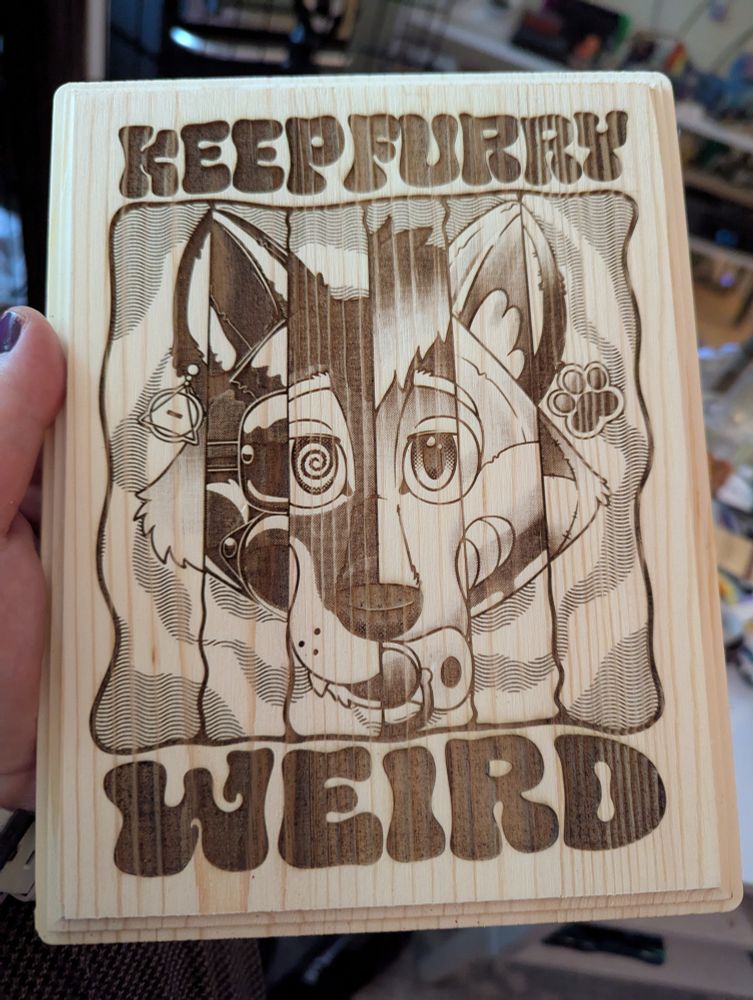 A plaque that reads "keep furry weird" with an image of a furry head representing Therians, latex, hypnosis, ABDL, pool Toys and plushies 