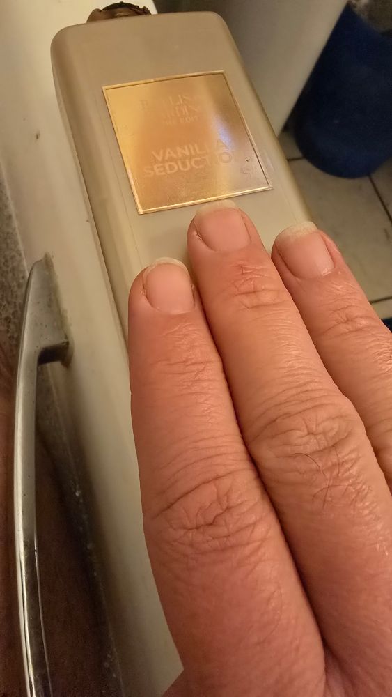 My three fingers across the width of a bottle of bath foam.