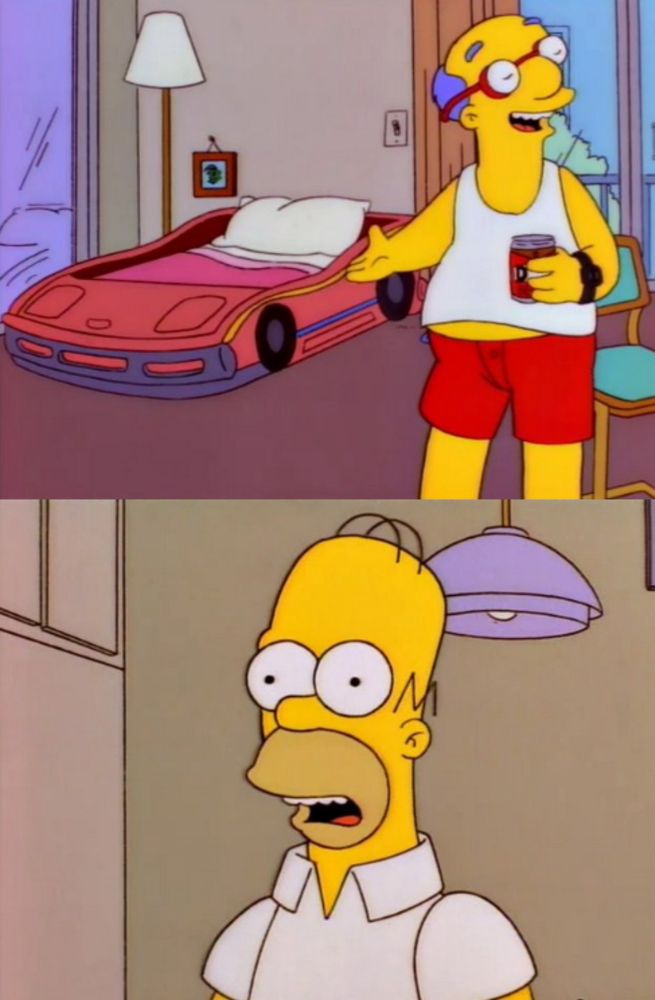 A two-panel screenshot from an episode of The Simpsons.  In the first panel Curt, Millhouse's dad, newly divorced and living in a shabby apartment, is pretending to be smugly satisfied with his situation and gesturing grandly to the child's bed in which he sleeps, shaped to look like a race car.  In the second panel, Homer is reacting in a very nonplussed manner, which serves to underscore the sad absurdity of Curt's transparent bravado.