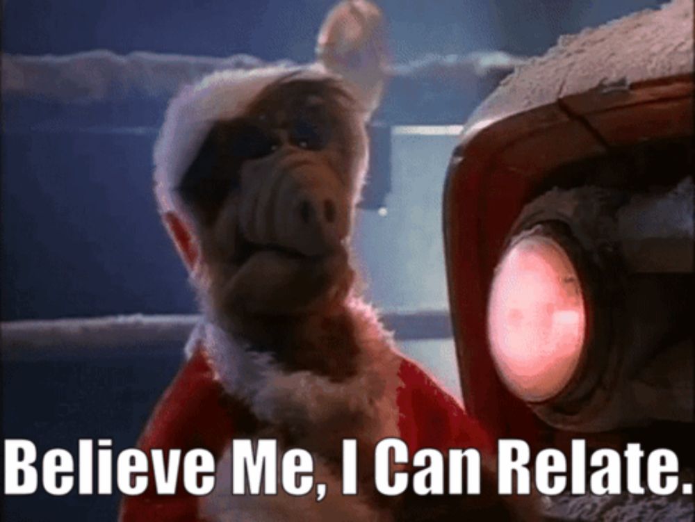 a monkey in a santa hat with the words believe me i can relate