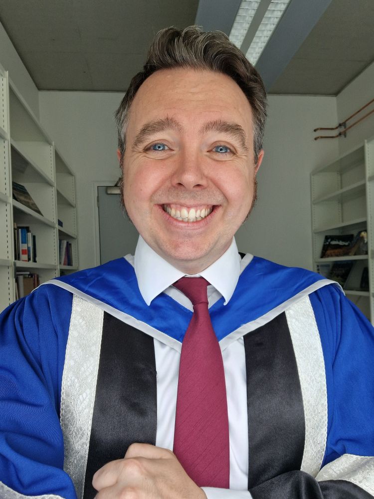 Grinning fool in a gown