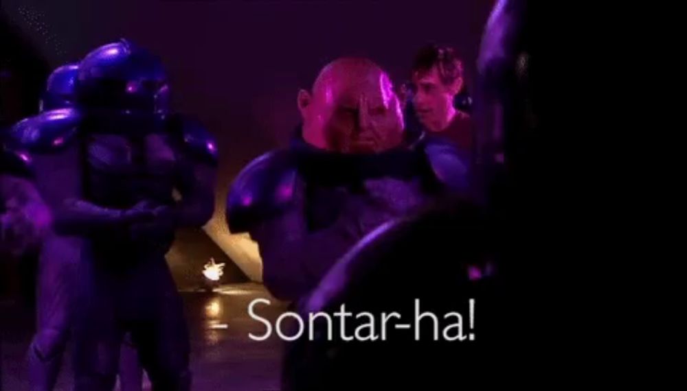 a group of people are standing in a dark room with the words sontar-ha on the bottom