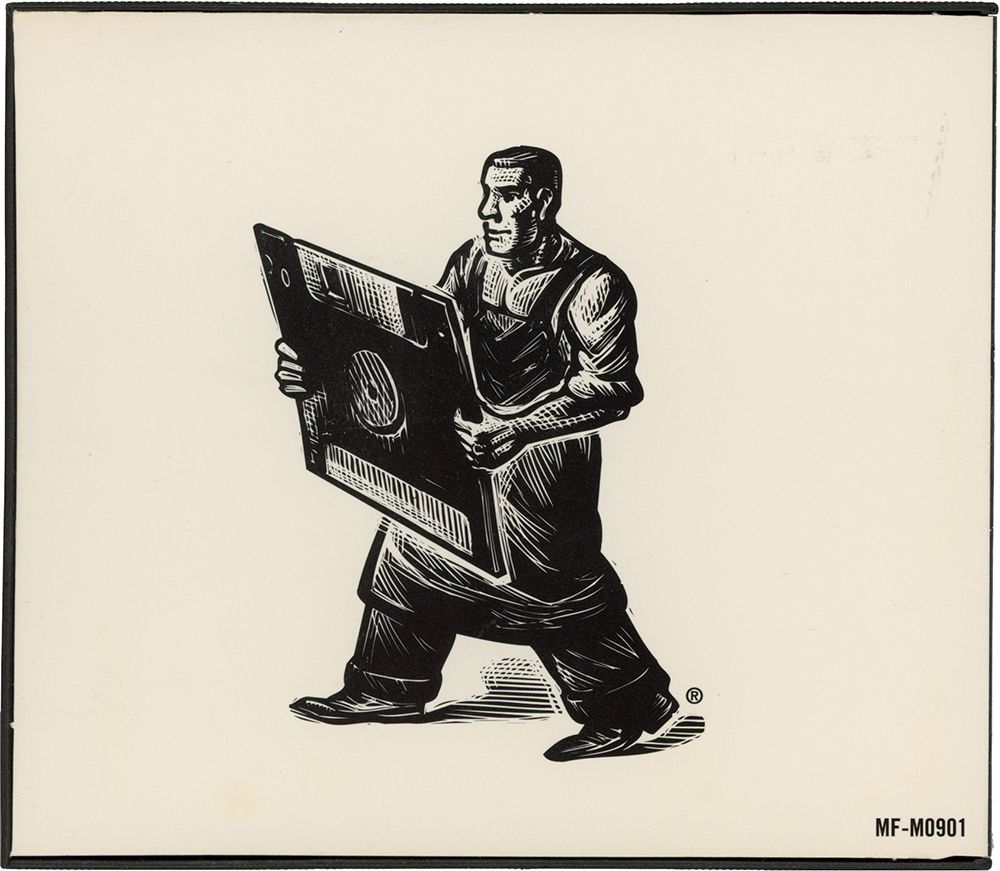 A black-and-white illustration of a muscled man in a workshop apron carrying a large 3.5" floppy disk.