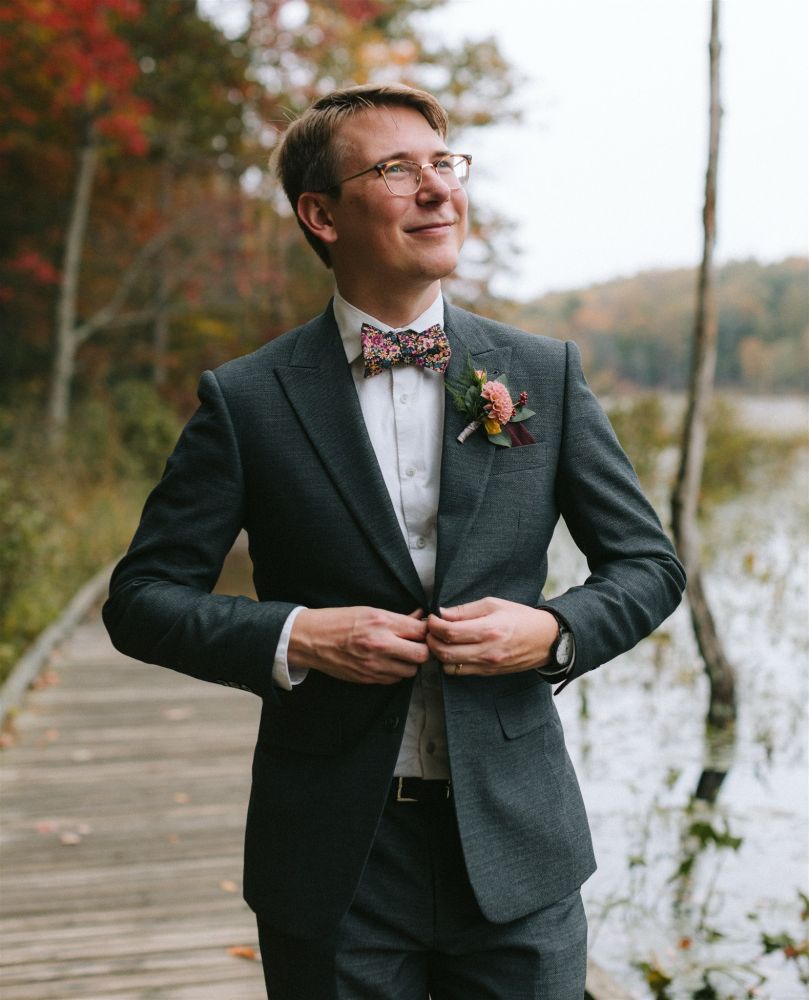 Me casually buttoning my suit