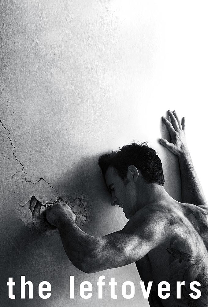 Poster for the show The Leftovers. The entire photo is in black and white. A shirtless man with short hair and a large, partially-visible back tattoo faces away from the camera. He is in obvious grief, leaning against a concrete wall. He is punching it with his left hand, leaving a crater in the wall, with a crack extending up from it. The show title "the leftovers" is written in white font in all lowercase across very bottom of the image.