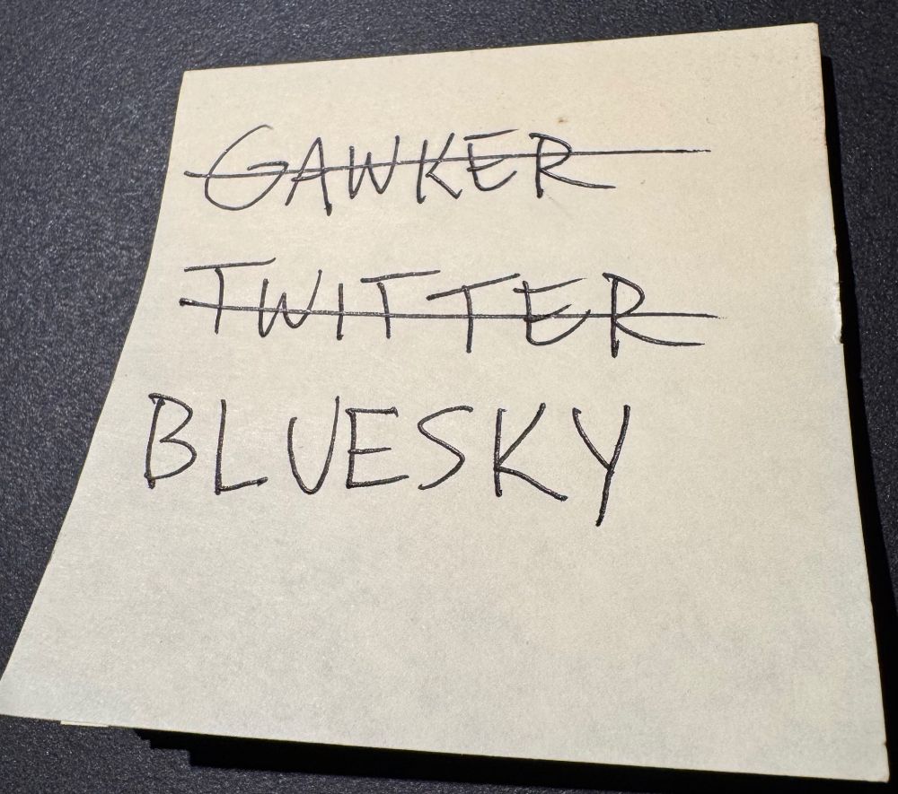 Post-It note with "Gawker" and "Twitter" crossed out, but "Bluesky" not yet crossed out.
