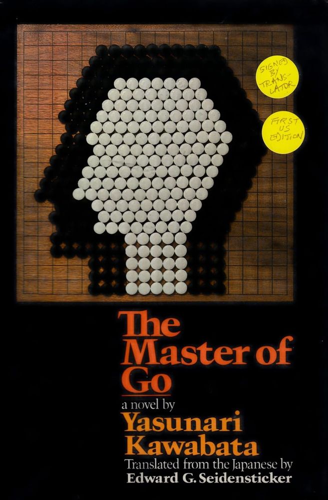 Cover of the book The Master of Go, novel by Yasunari Kawabata
The picture shows a go table with black and white stones arranged to form the stylised profile of a human face.