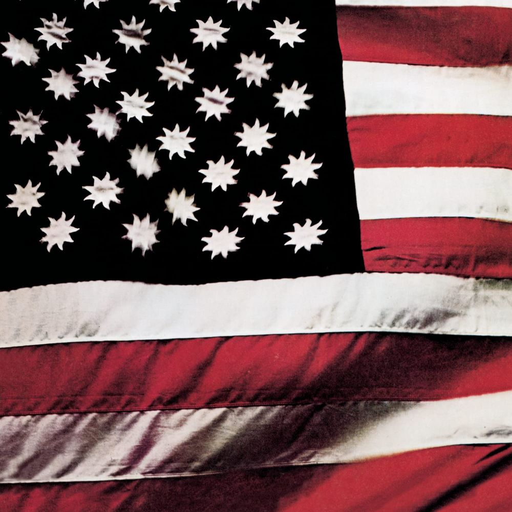The cover art for There's a Riot Goin' On by Sly and the Family Stone features a modified version of the flag of the United States, featuring a black canton with nine-point suns in place of a blue canton with five-point stars.