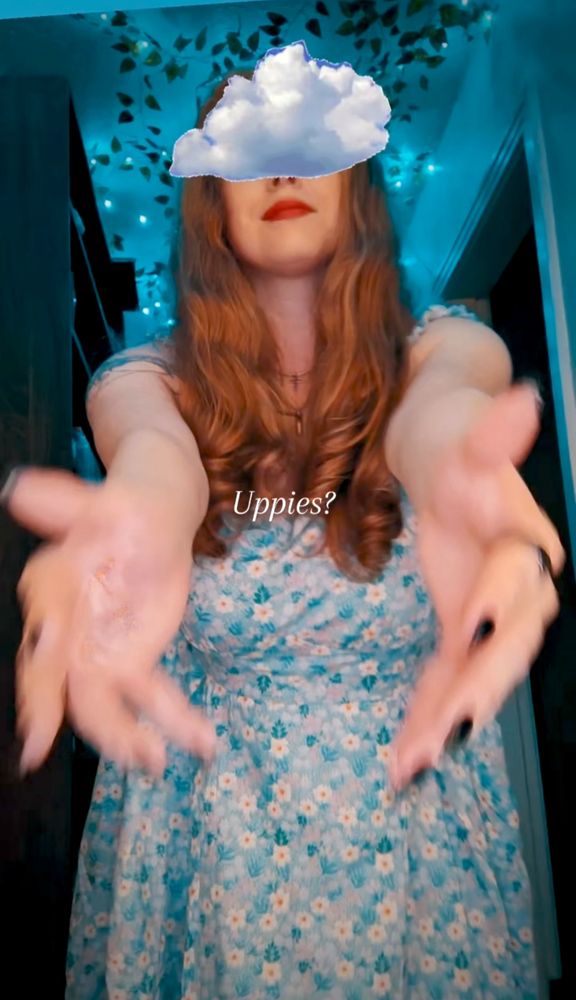 Me reaching out toward the camera with the word uppies overlayed 