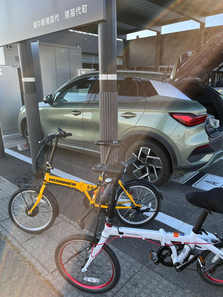 Our foldable bicycles by the fast EV charge point in Inawashiro “michi no eki.”