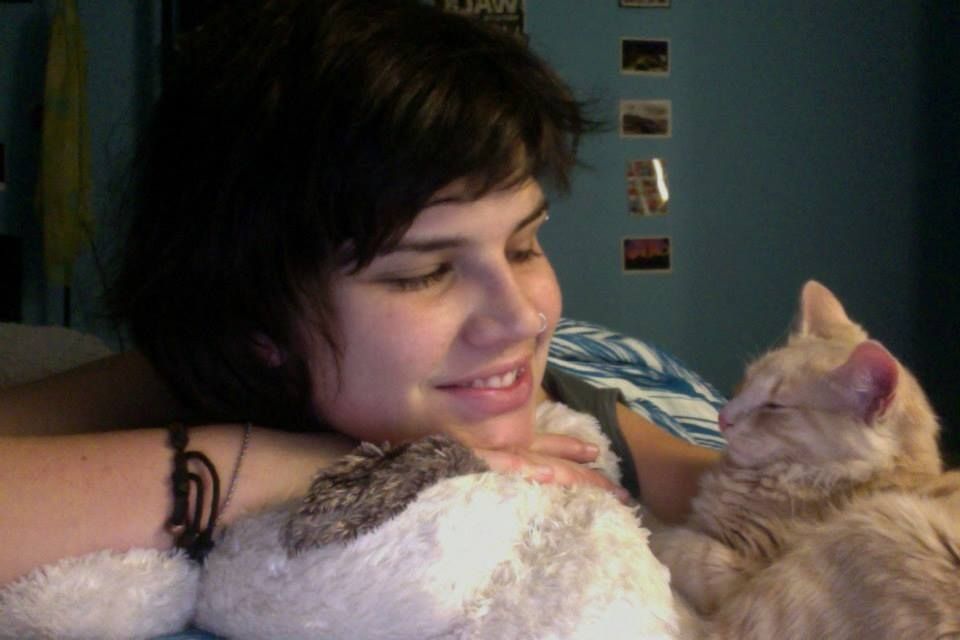 Selfie of me looking my cat iroh as a little cream kitten 