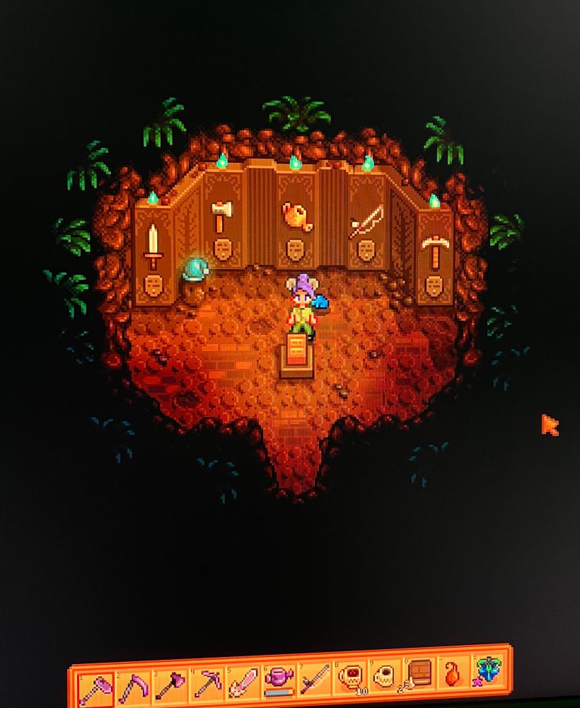 my stardew farmer standing in the mastery room with all of the torches lit