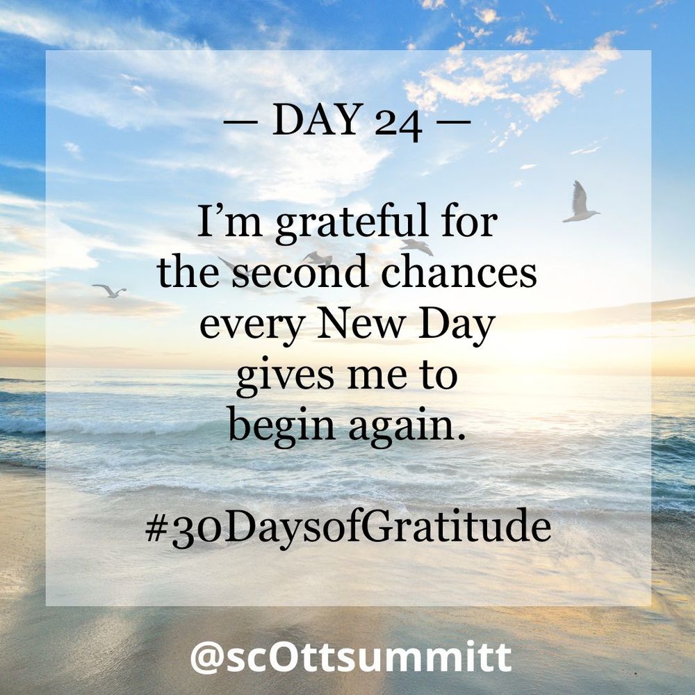 A picture of a beautiful white beach with rolling blue waves under a bright blue & sunny sky filled with seagulls. An opaque white box with black letters reading "Day 24 - I’m grateful for the second chances every New Day gives me to begin again.“ and the hashtag #30DaysofGratitude