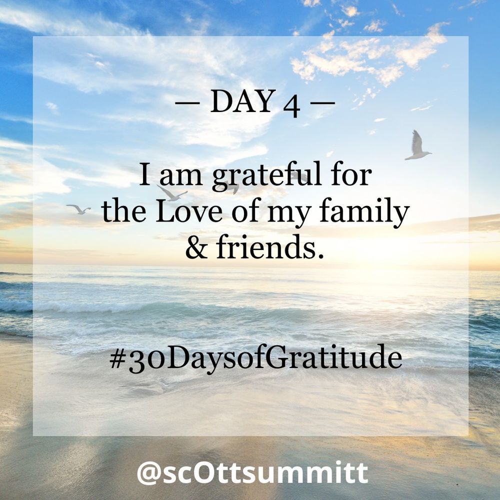 A picture of a beautiful white beach with rolling blue waves under a bright blue & sunny sky filled with seagulls. An opaque white box with black letters reading "Day 4 - I am grateful for the Love of my family & friends.“ and the hashtag #30DaysofGratitude.