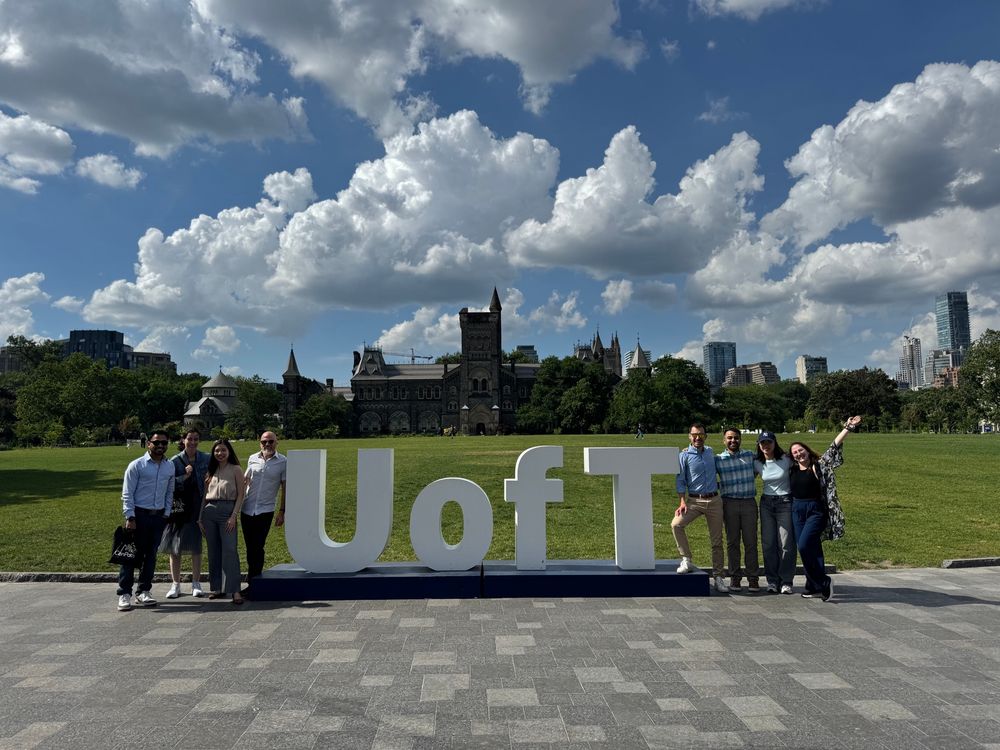 CanPath and Lifebit staff posing in front of the U of T sign in King’s Circle.