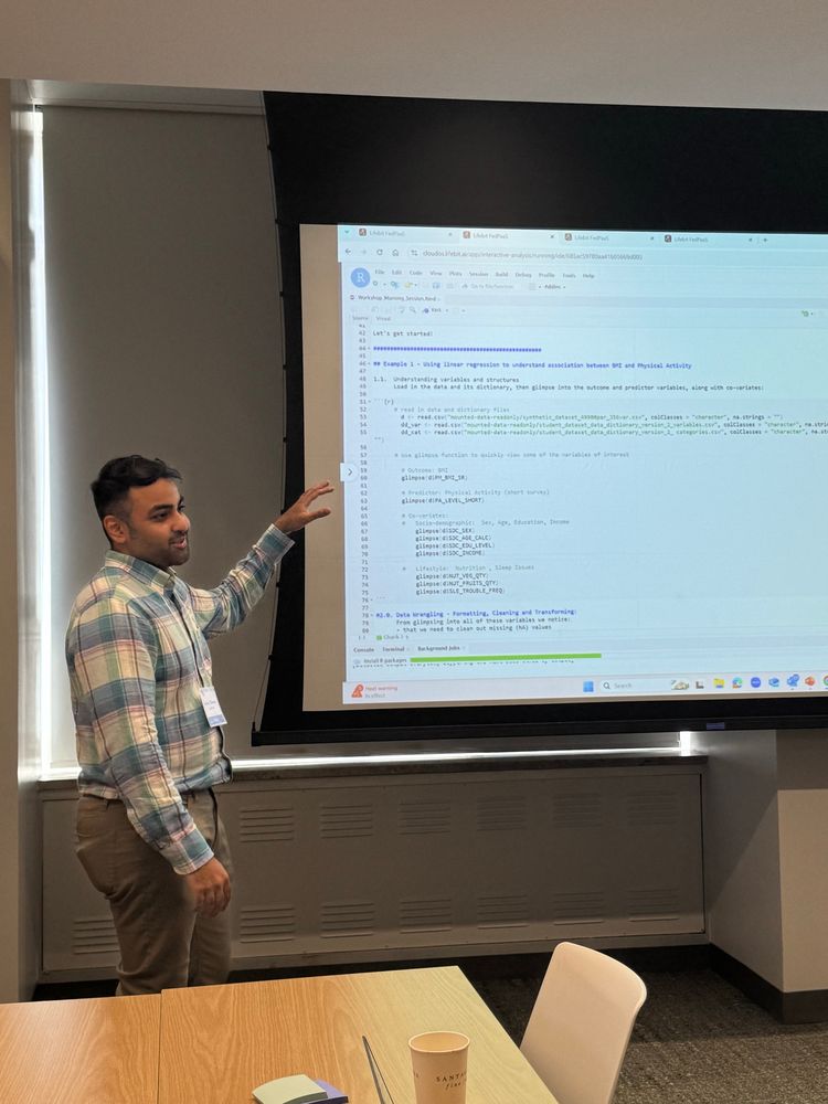Sheraz pointing to the presentation deck