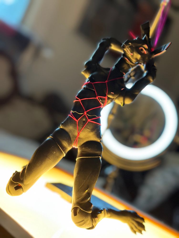 Ball jointed cay doll, posed in shibari