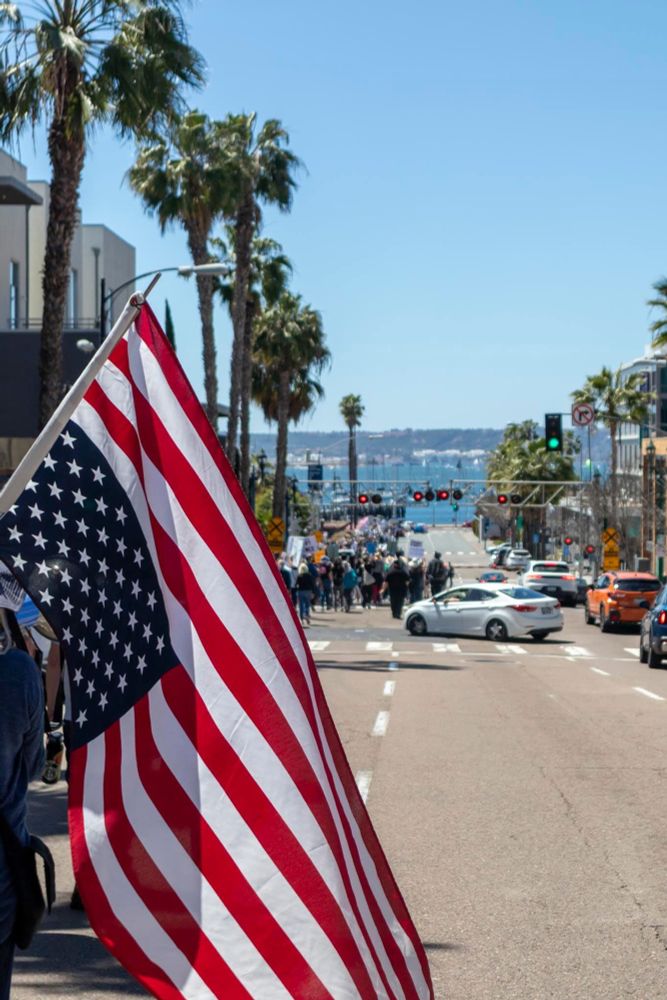 Upside down flag framing protest march