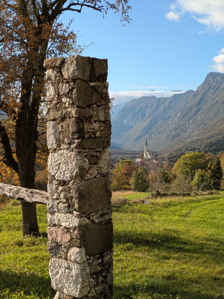 Old barn pillar framing the view to Dreznica 