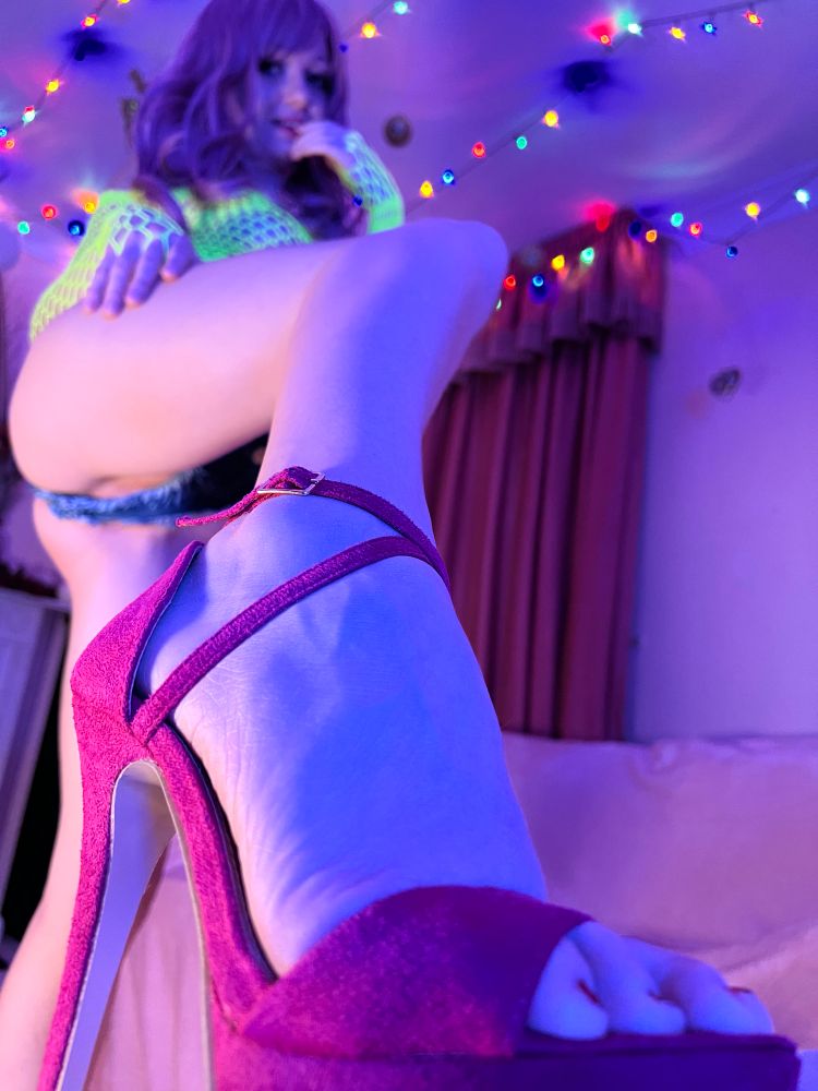 Woman in panties, high heels and neon top