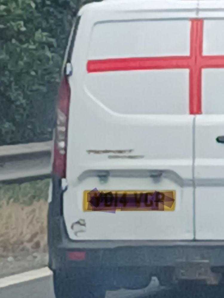 White van with St George's Cross on rear doors.