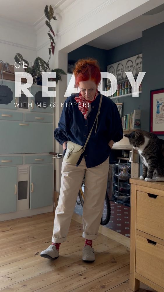 Ali and kipper the cat both looking at the slippers and thinking “how about boots?”