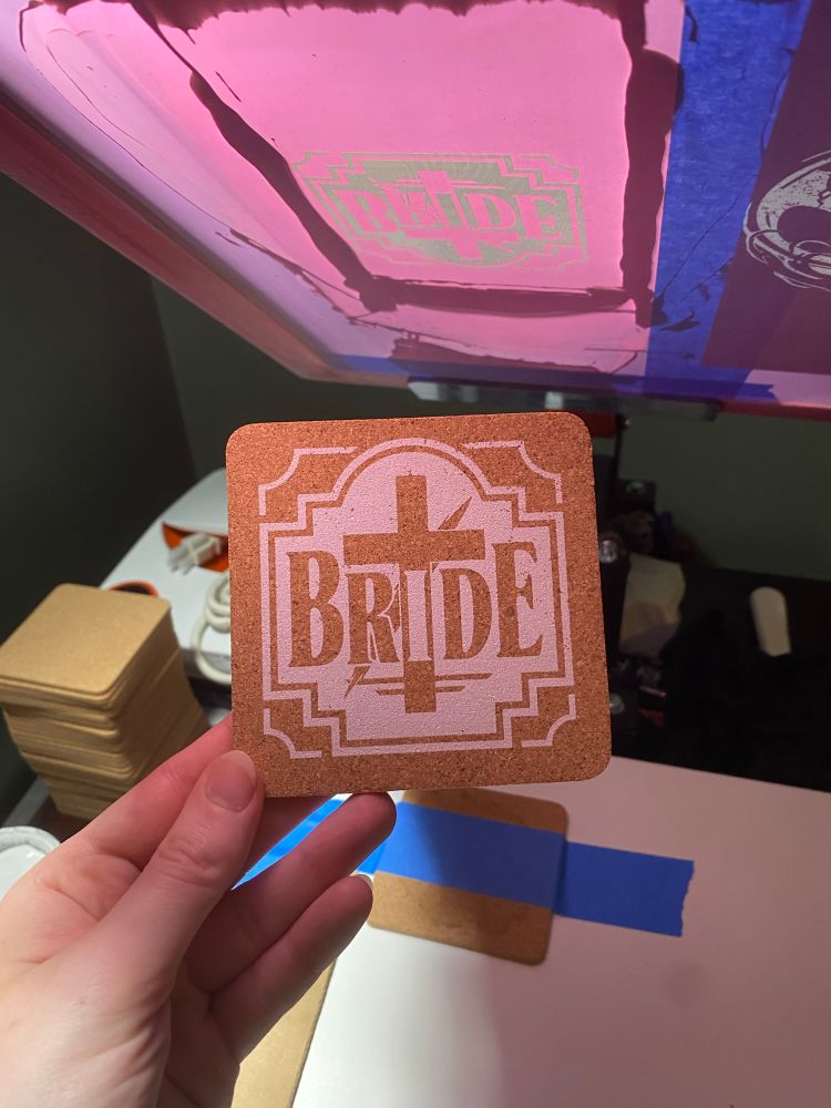 close up print of Bride logo on a cork coaster