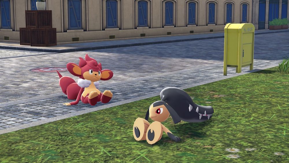 Screenshot from Pokemon Legends Z-A of a Mawhile and Pansear sitting on grass and concrete.