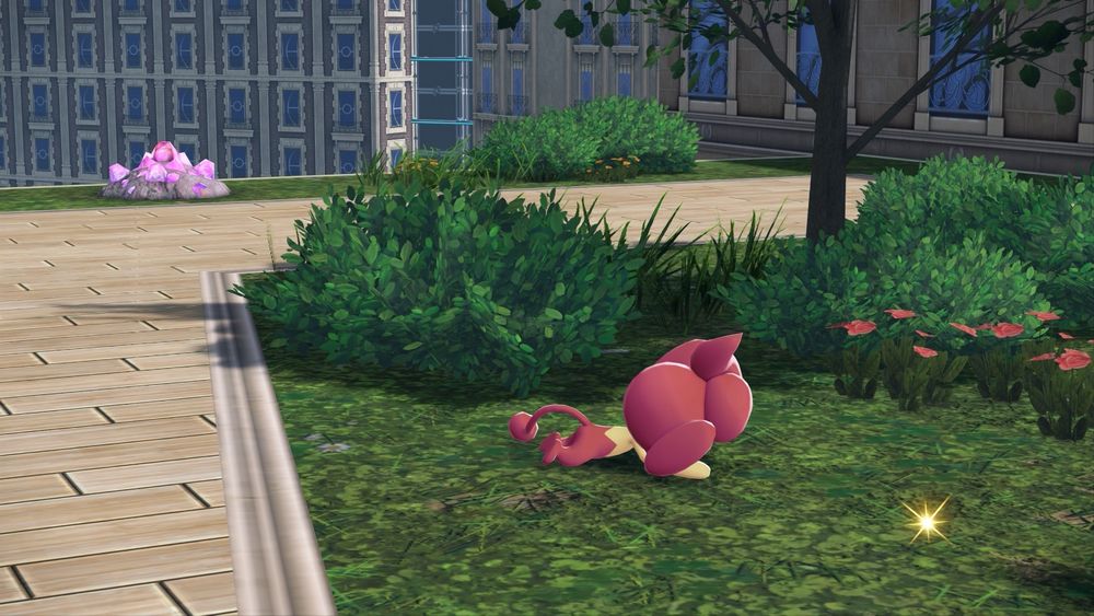 A screenshot of the Pokemon Pansear face down on a patch of grass
