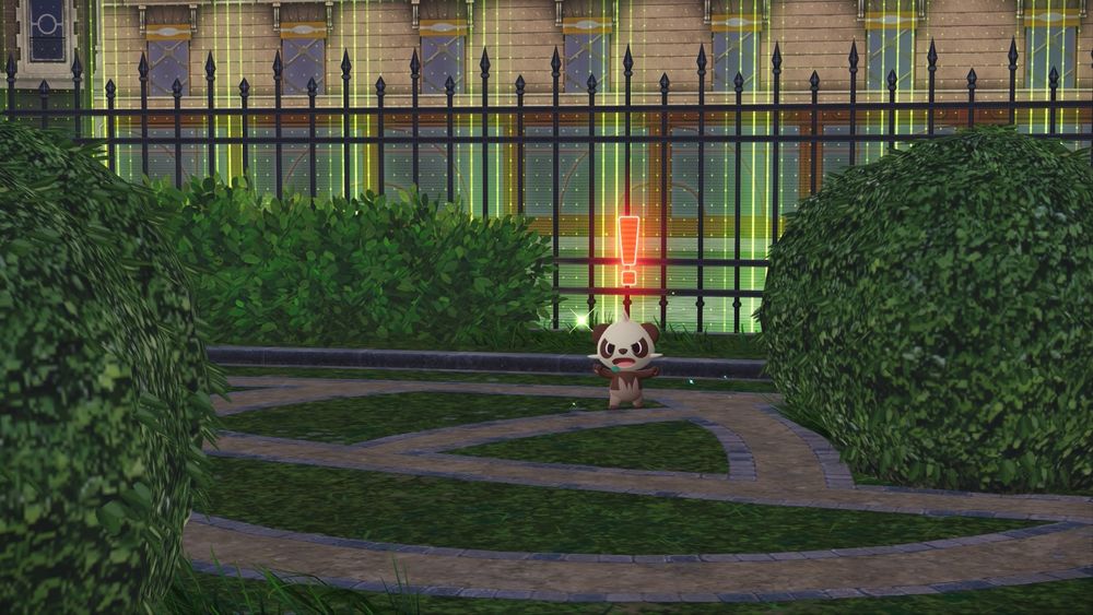 Screenshot of a shiny Pancham in Pokemon Legends Z-A. It is standing in the middle of a fenced garden with a red exclamation point above its head.