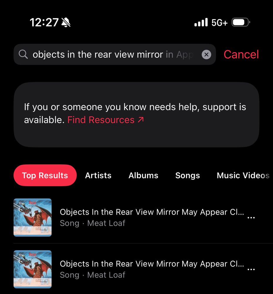 A search result in Apple Music that includes a tab up top reading “If you or someone you know needs help, support is available. Find Resources” before displaying the relevant songs 
