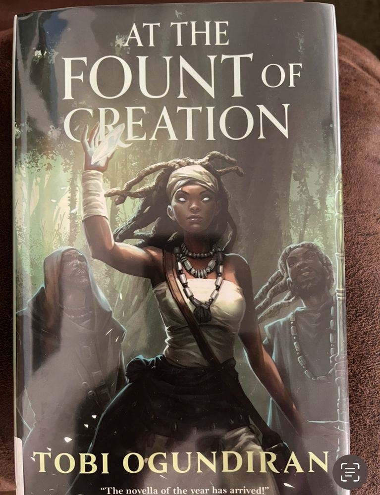 Cover of the book At the Fount of Creation by Tobi Ogundiran. It shows the main character, Ashâke, flanked by two other characters.