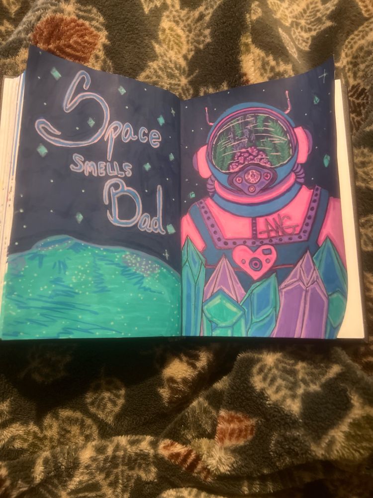 Astronaut wearing pinki,blue and purple space suit with plant life in their helmet for odor control because “space smells bad”(which the is what the text says) there is no visible face behind the plants. Blue, green and purple crystals are in front of the astronaut on a planet with similar colors. 