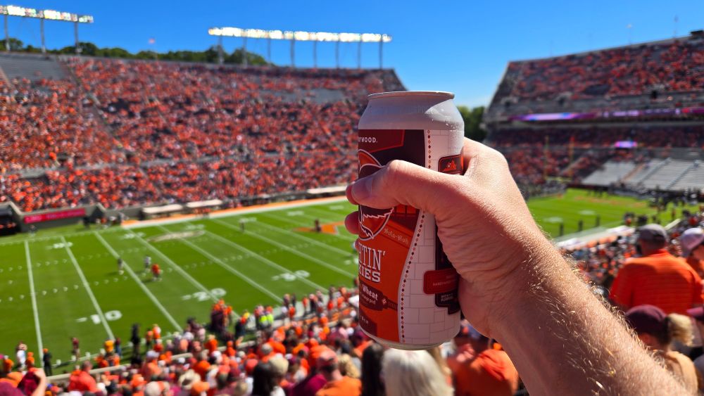 A beer raised to the field pregame at Lane Stadium 
