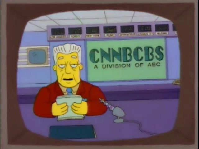 Simpsons screenshot, featuring an aged newsman Kent Brockman hosting on a network called “CNNBCBS: A division of ABC”
