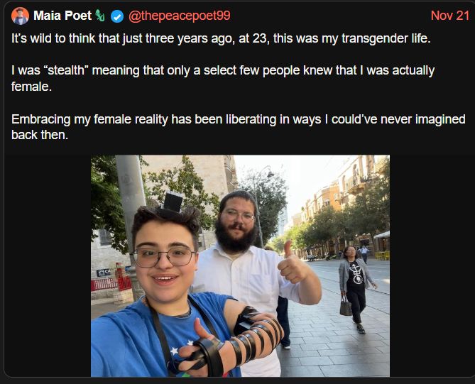 Detransition grifter, Cyril Fletcher/Adrian More-alike and zionist nutter Maia Poet with Jewish head gear, a proper gormless look on her face, and a big Selwyn Frogget esque thumbs up. Magic, our Maia. 