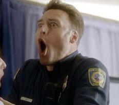 Eddie Diaz from 9-1-1. His eyes are wide, and his mouth extended open like a fish gasping for water. For context if it helps the imagination, a man has his balls in a death grip