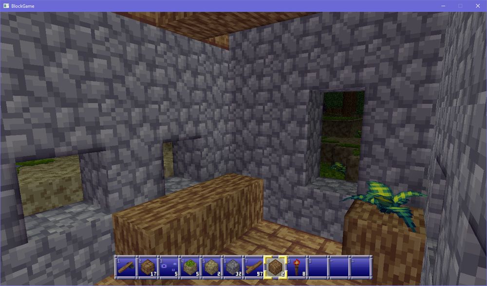 inside of a little house. there's two small windows on the long end of the wall next to a log bench. in the corner a log sits with a fern on top. the short wall has a taller window. there appears to be a beam holding up the ceiling. it is currently dark outside