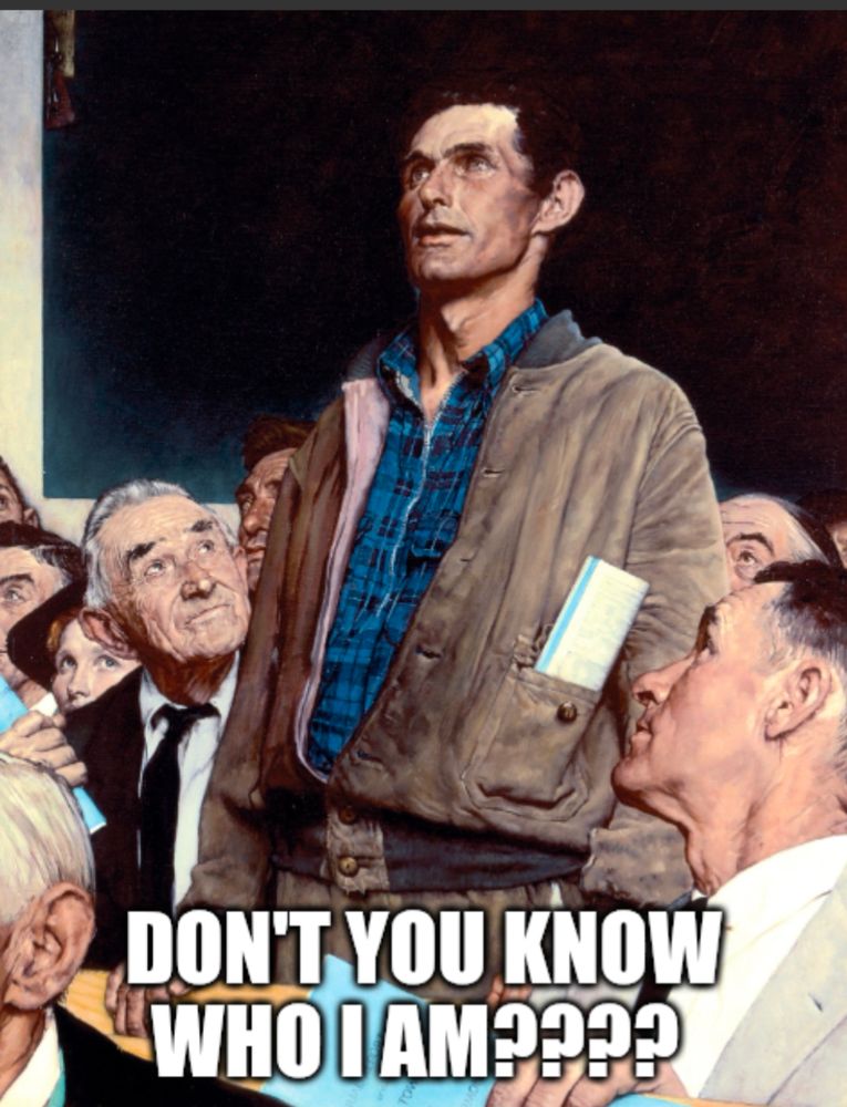 Man stands at a meeting saying, 