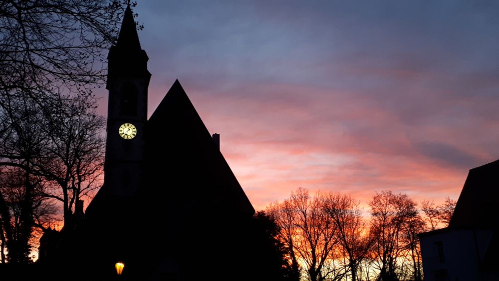 Dark church in front of the backlight of the sundown.