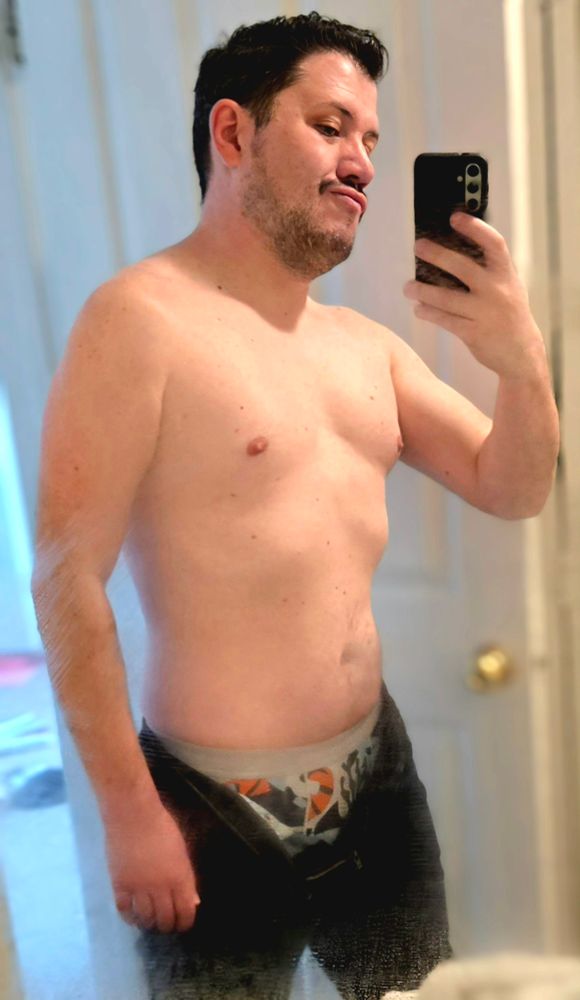 shirtless with pants unbuttoned